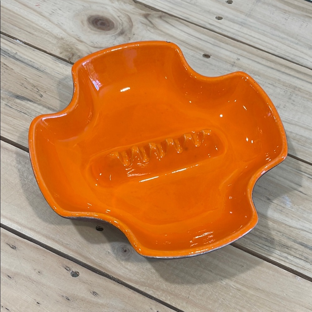 California Pottery funky bright orange ashtray. Stamped 2005.